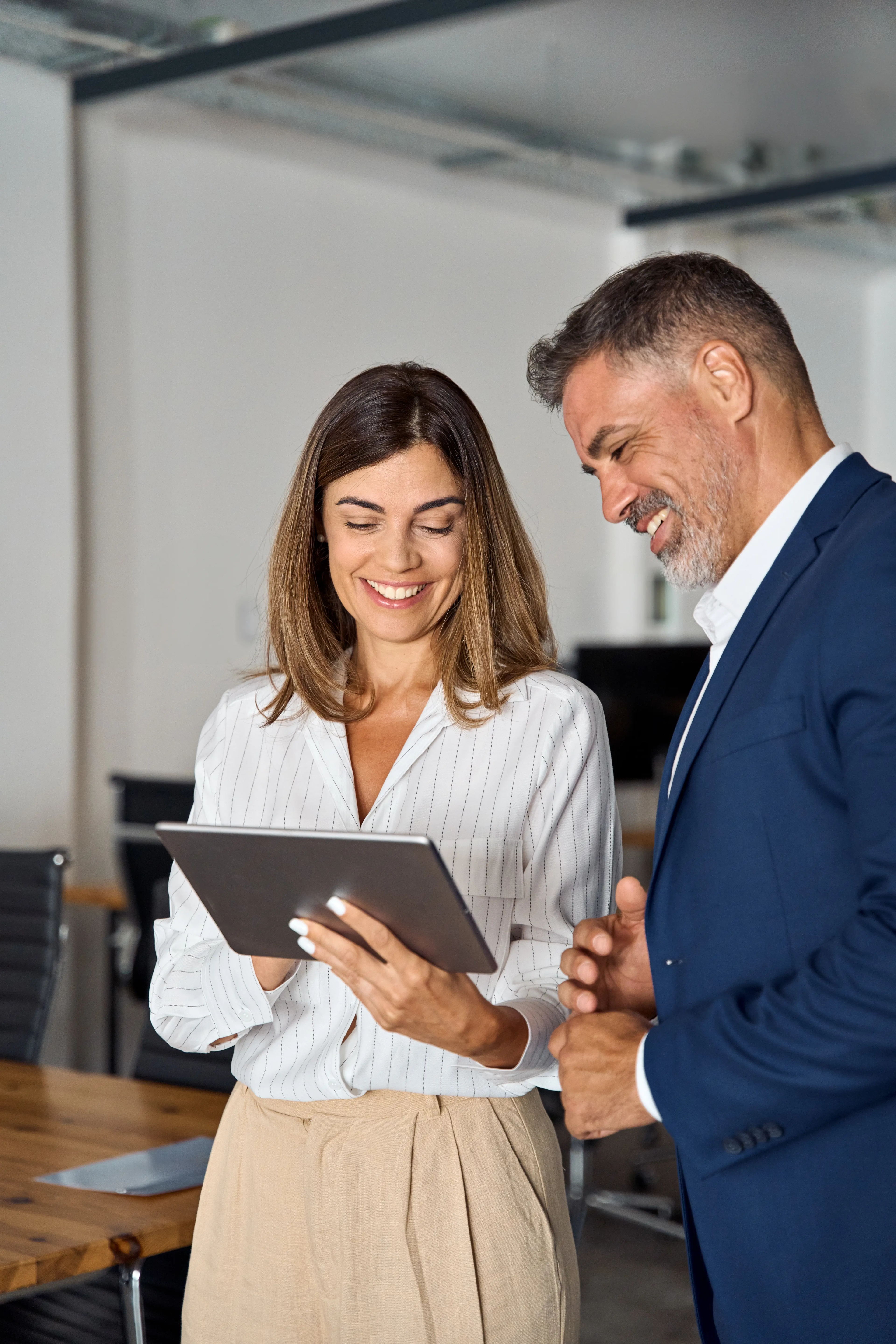 Lady and man holding tablet